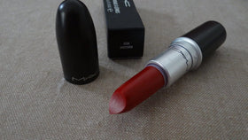MAC Russian Red inside a makeup bag showcasing everyday carry and convenience