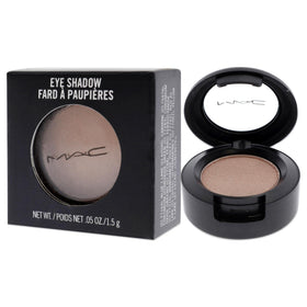 MAC model applying Naked Lunch on lids showing luminous finish benefit