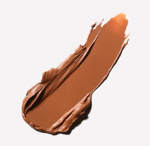 MAC Studio Fix Tech tube in hand showing 0.35 oz size for portable touch-ups