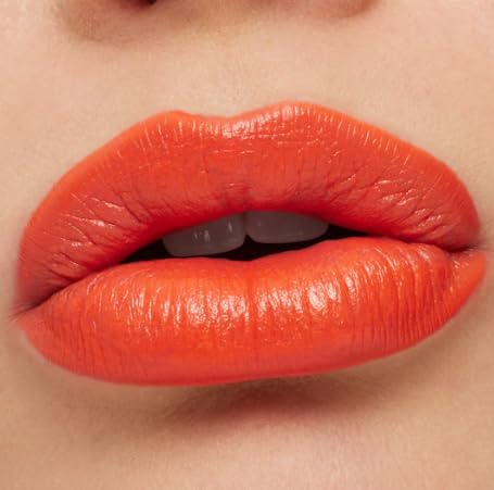 MAC Ximal lipstick lip swatch on arm highlighting true Morange payoff and smooth satin finish benefit