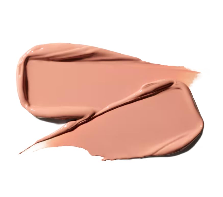 MAC lipstick swatched on lips in lifestyle setting illustrating Fleshpot warm beige nude