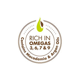 Macadamia Natural Oil bottle held in hand to show size and easy application benefit