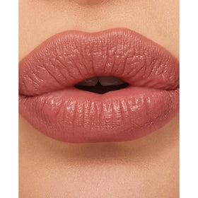 MAC lipstick inside a makeup bag suggesting portability and everyday use