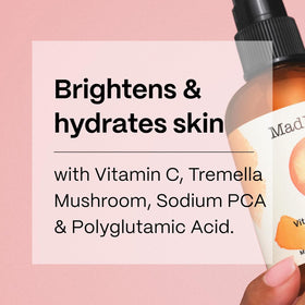 Person misting face with Mad Hippie in bathroom for instant refresh benefit