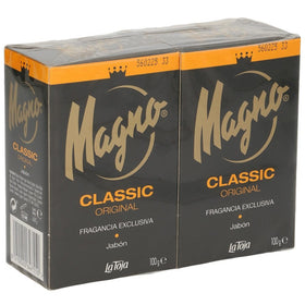 Magno Classic Black size comparison with a hand to show 3.5 oz bar scale and portability