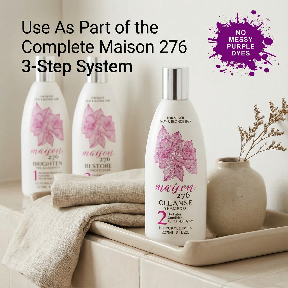 Maison 276 hydrate bottle styled on bathroom shelf with towels, evokes thoughtful routine