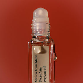 Maison Louis Marie Icila roll-on in hand for scale and discreet reapplication convenience