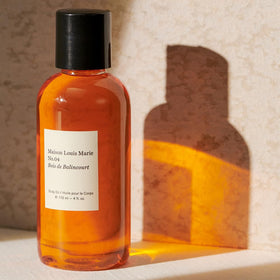 Maison Louis Marie oil in hand being massaged into skin for instant hydration benefit