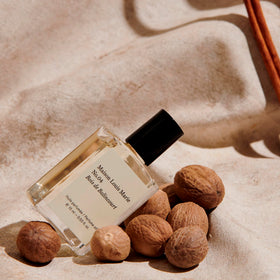 Maison Louis Marie 15ml size comparison beside a key for travel-friendly convenience