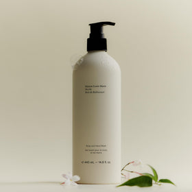 Maison Louis Marie bottle beside common items showing actual 440 ml scale benefit