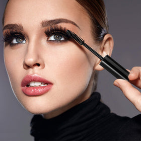 Maitys filled mascara tube held in hand showing portable cosmetic storage benefit