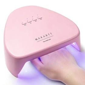 Makartt front view of compact lamp showing sleek pink finish and user-friendly design