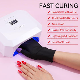 Makartt lamp next to a hand for scale showing compact size and salon-grade power