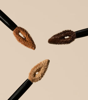 MAKE concealer styled in clutch bag showing portability for on-the-go touch-ups