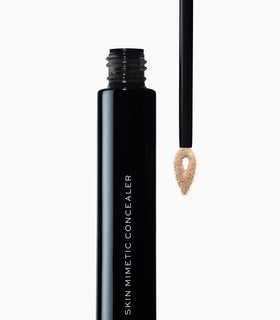 MAKE concealer texture swatch on skin displaying hydrating, blendable finish