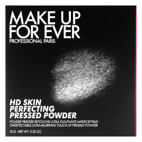 Make Up For Ever powder being used for touch-up in mirror to reduce midday shine