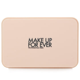 Make Up For Ever compact beside coin to show size, portable convenience benefit