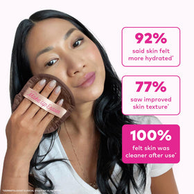 MakeUp Eraser held in hand to show compact size and travel-friendly benefit
