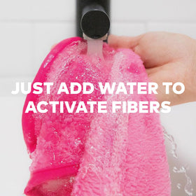 MakeUp Eraser in hand wiping mascara demonstrating deep-clean benefit