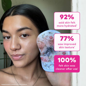 MakeUp Eraser beside hand to show compact travel-friendly size and portability