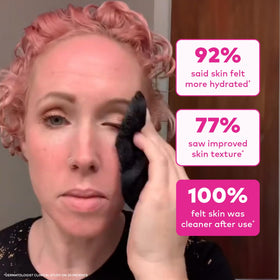 MakeUp Eraser beside a hand for size scale showing compact travel-friendly size benefit