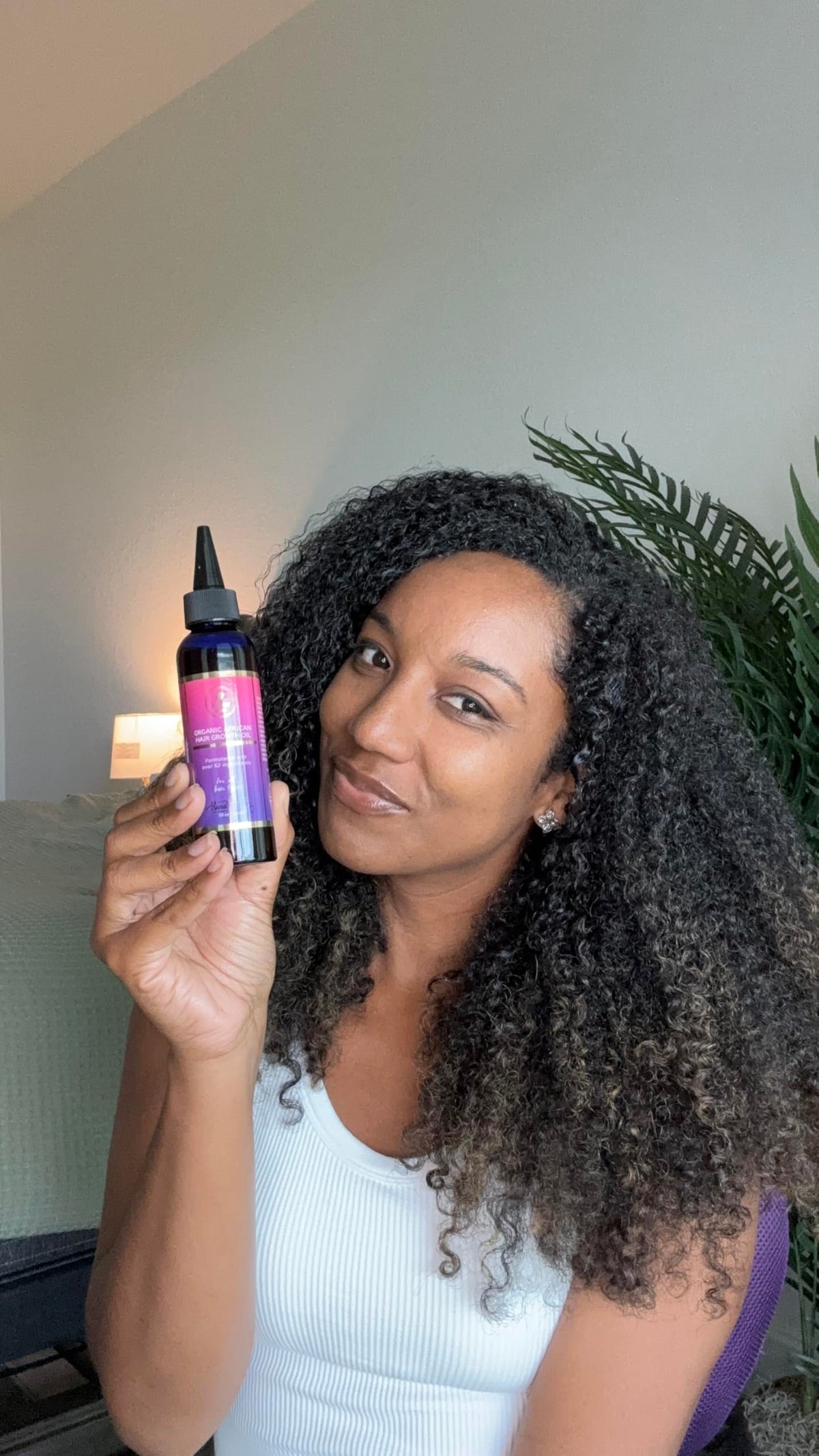 MAKOF BEAUTY oil on bathroom shelf in lifestyle setting for daily use