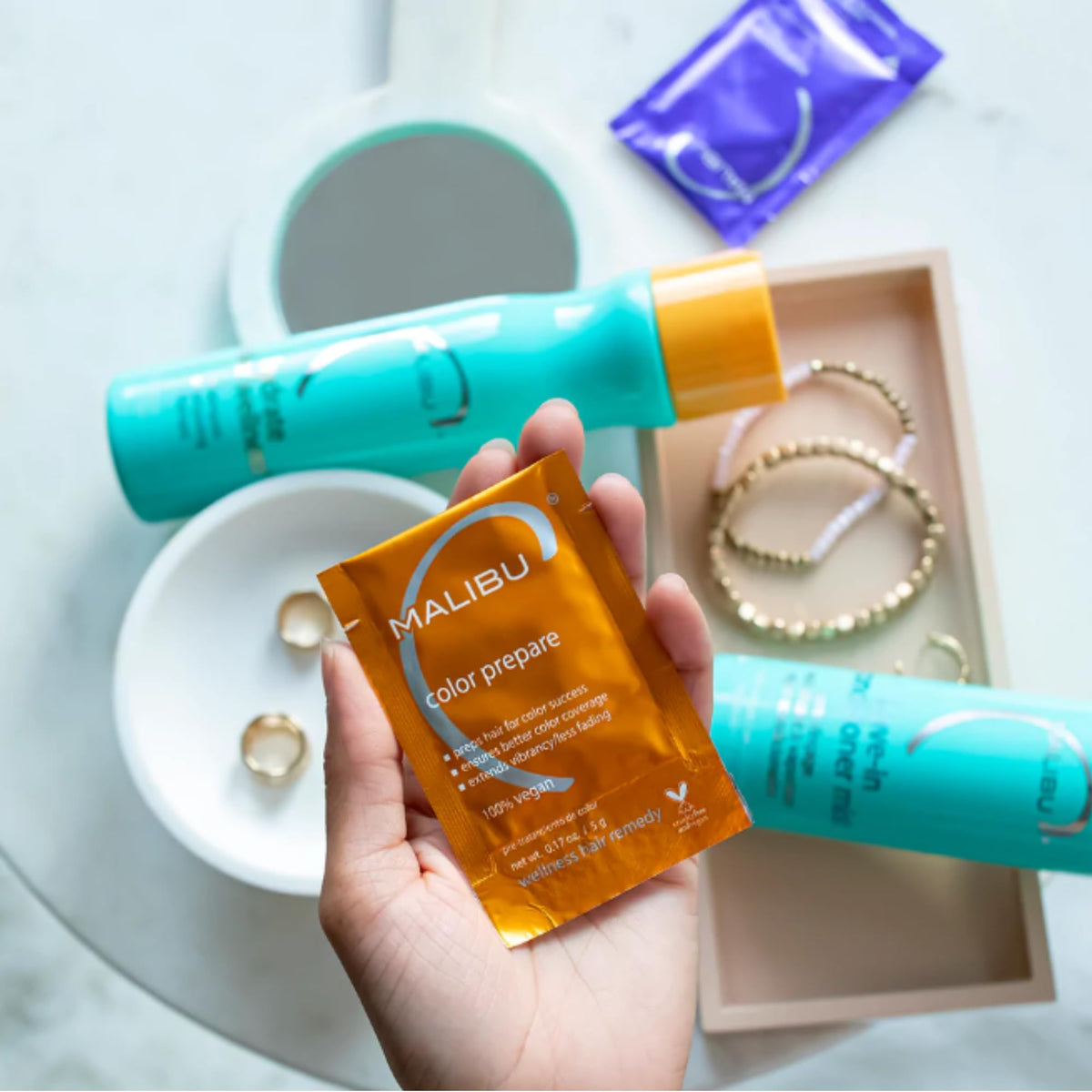 Malibu C Color Prepare crystals in hand prepping hair for color protection