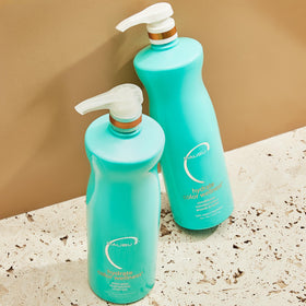 Malibu C in bathroom setting applied to wet hair, shows hydration and color care benefits
