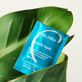 Malibu C creamy mask texture visible, showing rich formula for deep hydration