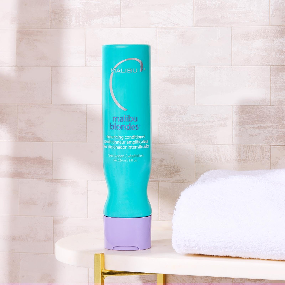 Malibu C purple conditioner texture on hand showing creamy hydration