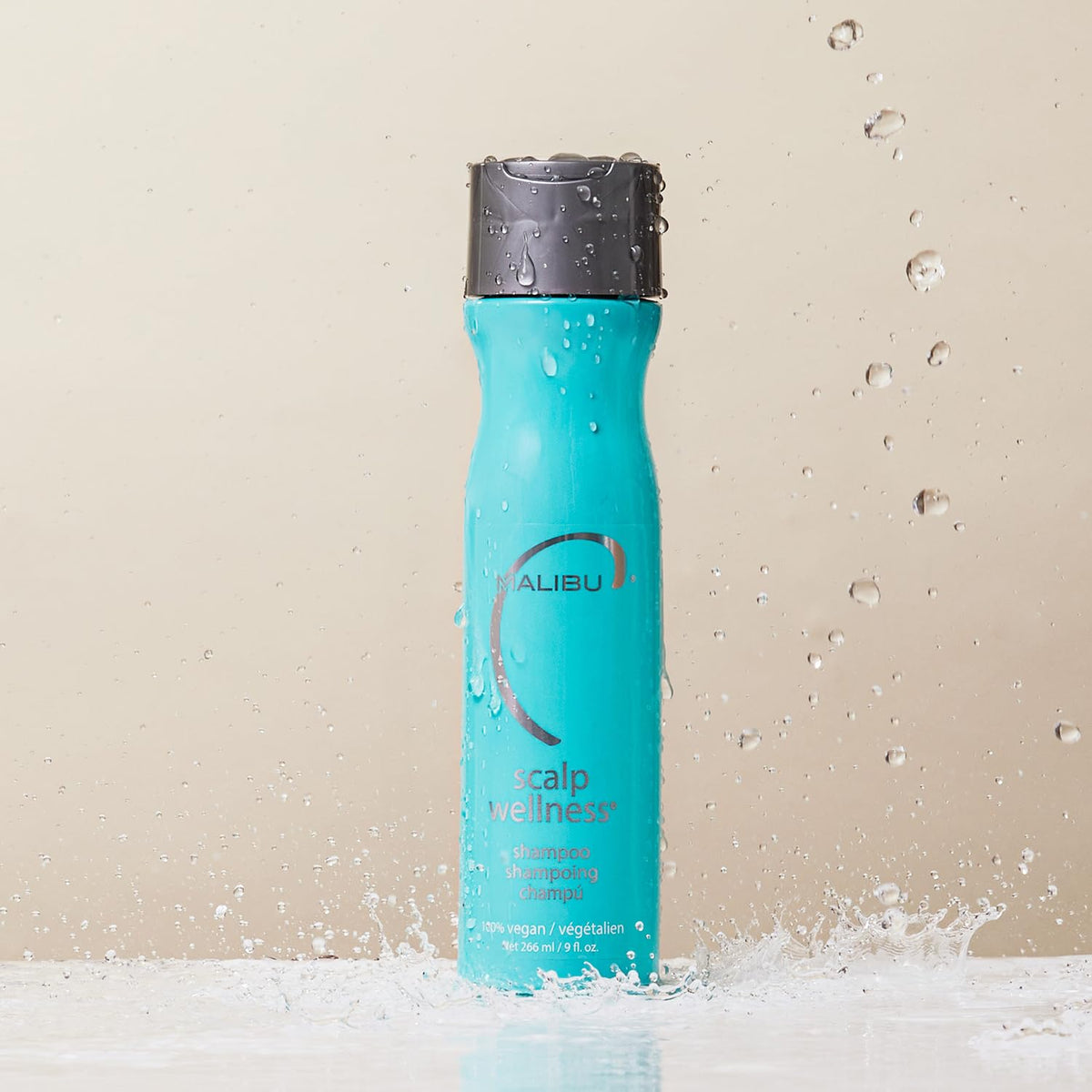 Malibu C bottle close-up with pump and readable label promoting gentle cleansing