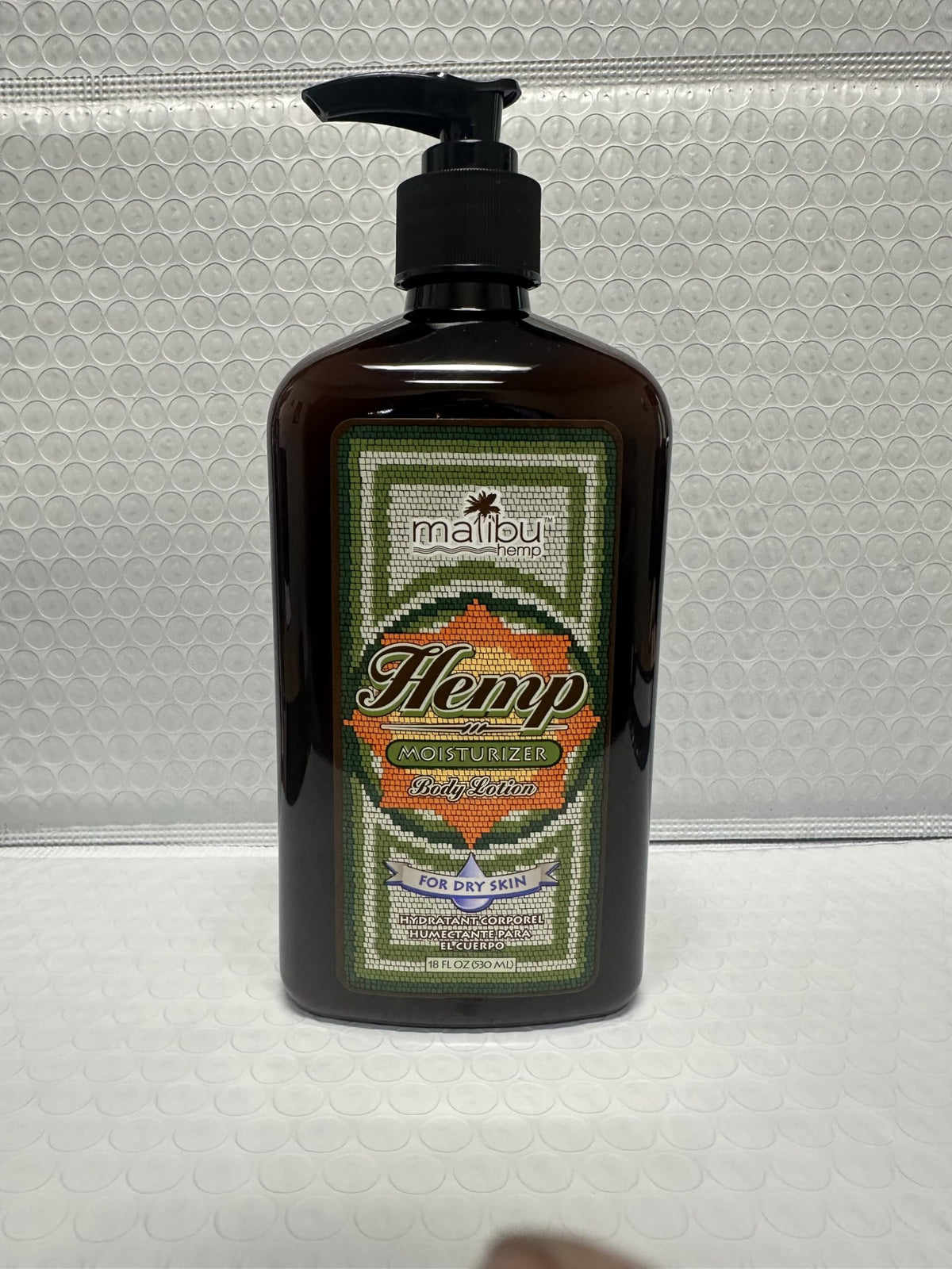 Malibu Tan ingredient label close-up showing hemp-derived oil information and transparency