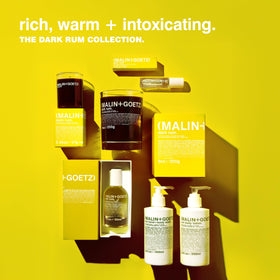 MALIN+GOETZ bottle styled on bathroom sink conveying modern design and everyday use