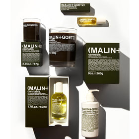 MALIN+GOETZ bottle in modern bathroom setting showing stylish packaging and decor benefit