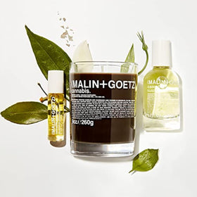 MALIN+GOETZ perfume oil inside purse highlighting portability and on-the-go refresh