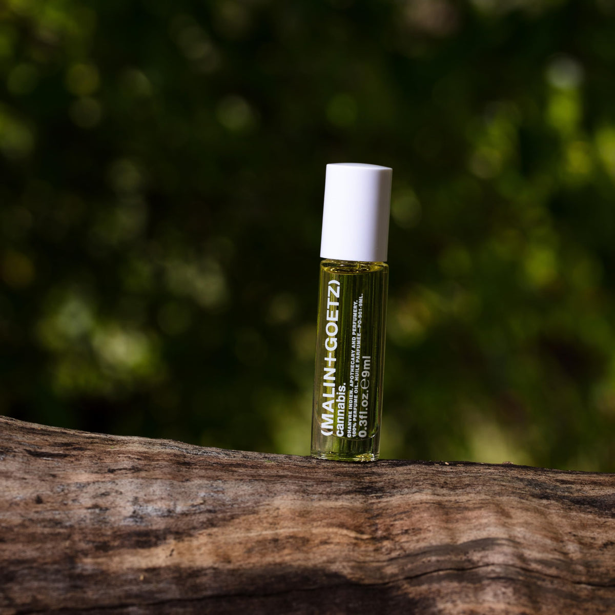MALIN+GOETZ rollerball in hand indicating small 0.2 fl oz travel-friendly size