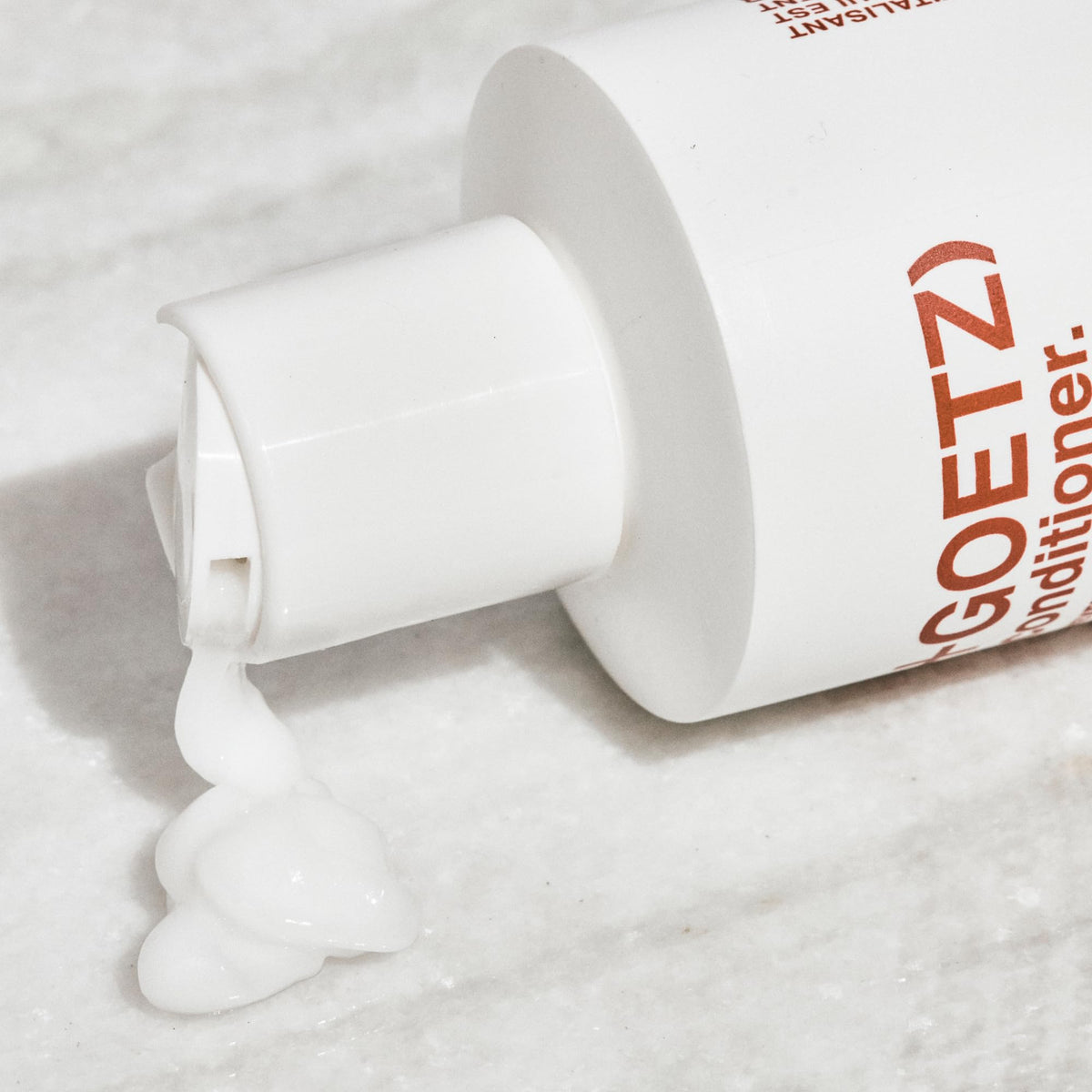 Malin + Goetz conditioner staged in bathroom showing everyday routine compatibility