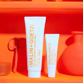 MALIN+GOETZ sunscreen inside a travel bag showing reef-safe protection for on-the-go routines