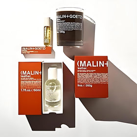 MALIN+GOETZ rollerball held in hand to show compact size and effortless carry benefit