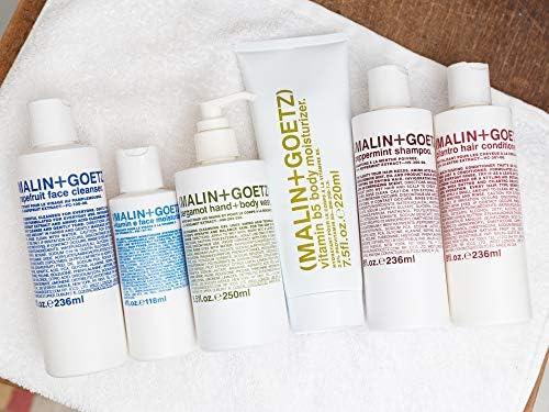 MALIN+GOETZ jar styled on bathroom counter suggesting everyday routine use