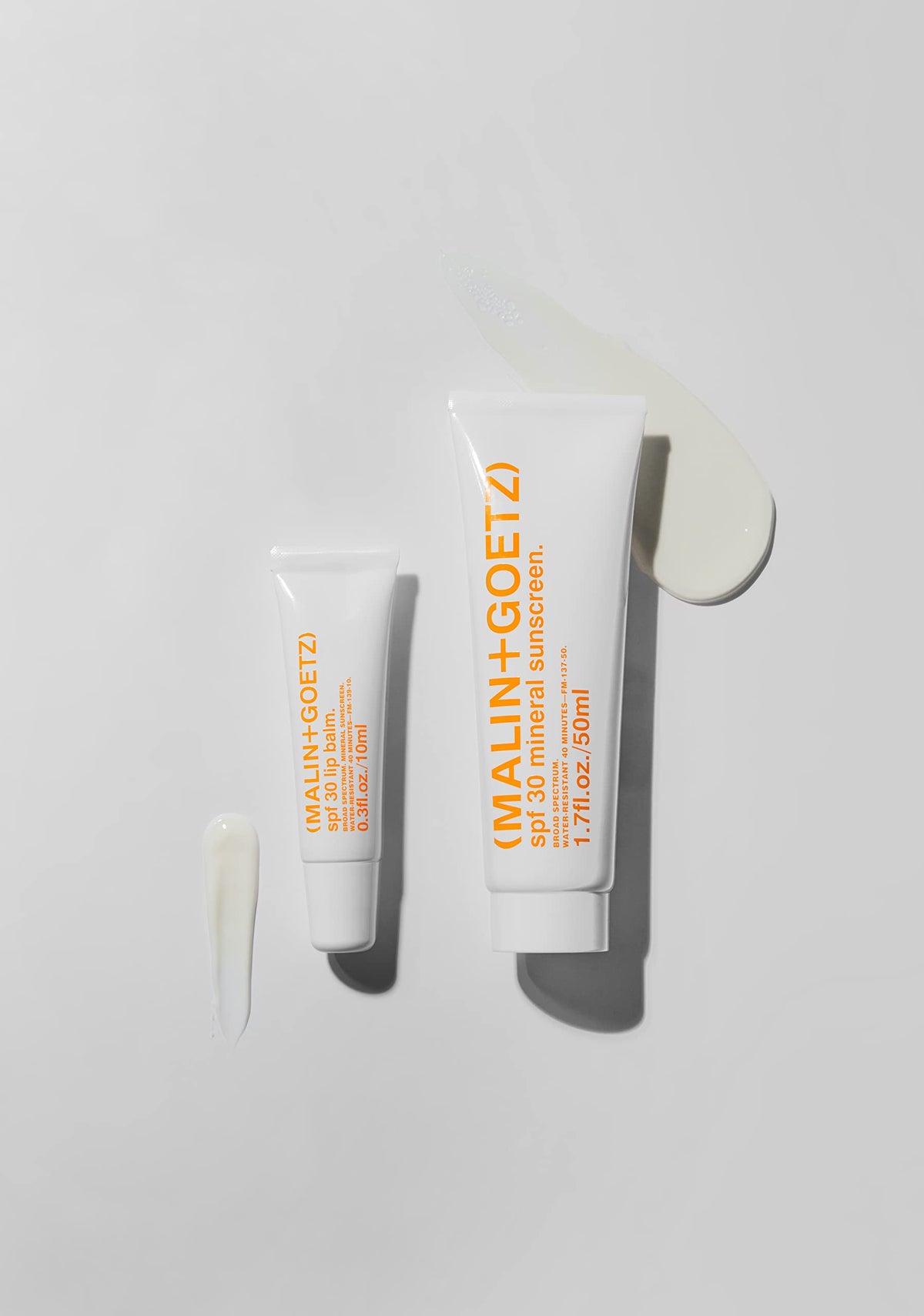 MALIN+GOETZ product in outdoor setting illustrating reef-safe sun protection benefit