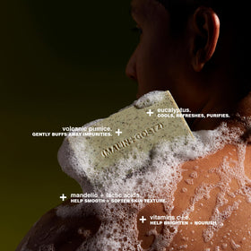 MALIN+GOETZ close-up of bar texture revealing pumice and jojoba for gentle buffing