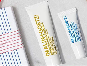 MALIN+GOETZ size comparison with coin showing pocket-friendly 0.35 fl oz