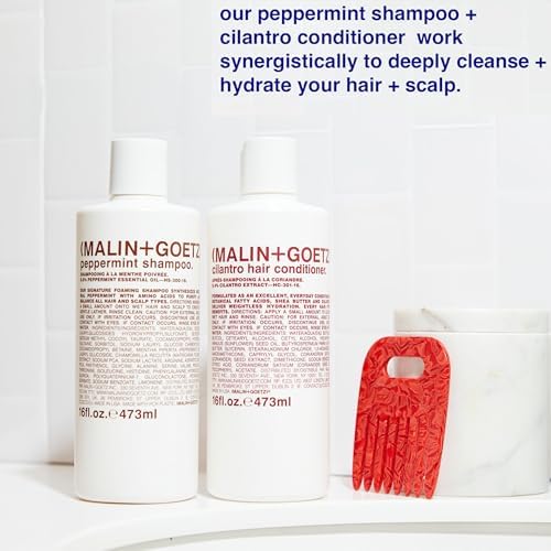 MALIN+GOETZ bottle on bathroom shelf in lifestyle scene suggesting travel-ready use