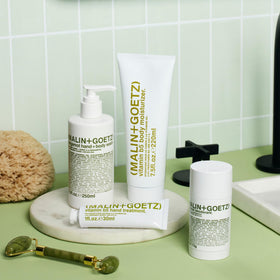 MALIN+GOETZ in bathroom lifestyle scene showing daily routine benefit