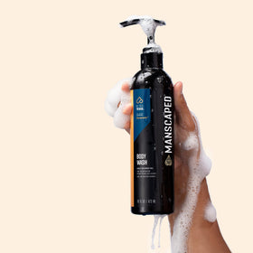 MANSCAPED aloe and sea salt ingredients next to bottle, emphasizes soothing and exfoliating benefits