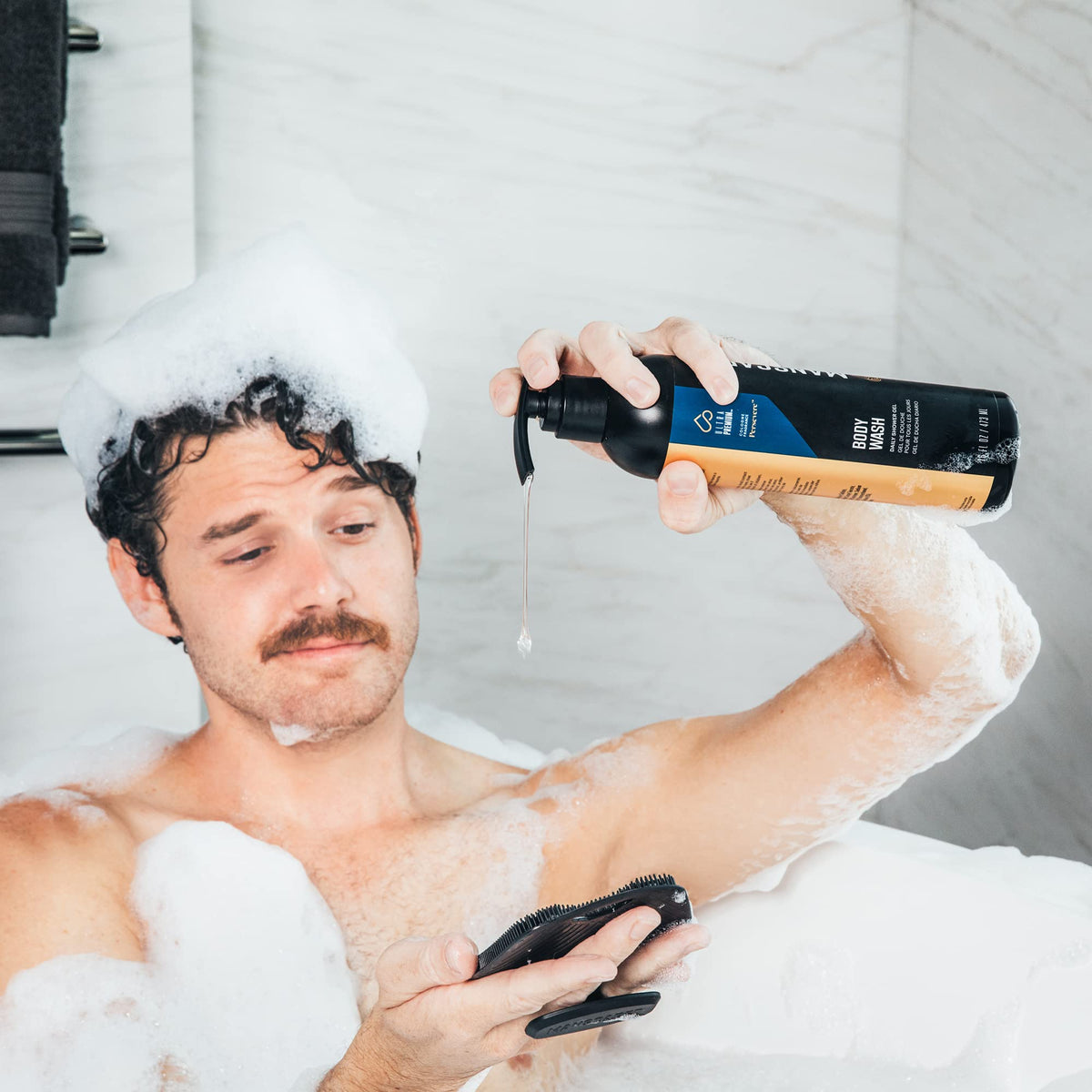 MANSCAPED pump close-up dispensing body wash, demonstrates easy use for controlled amounts