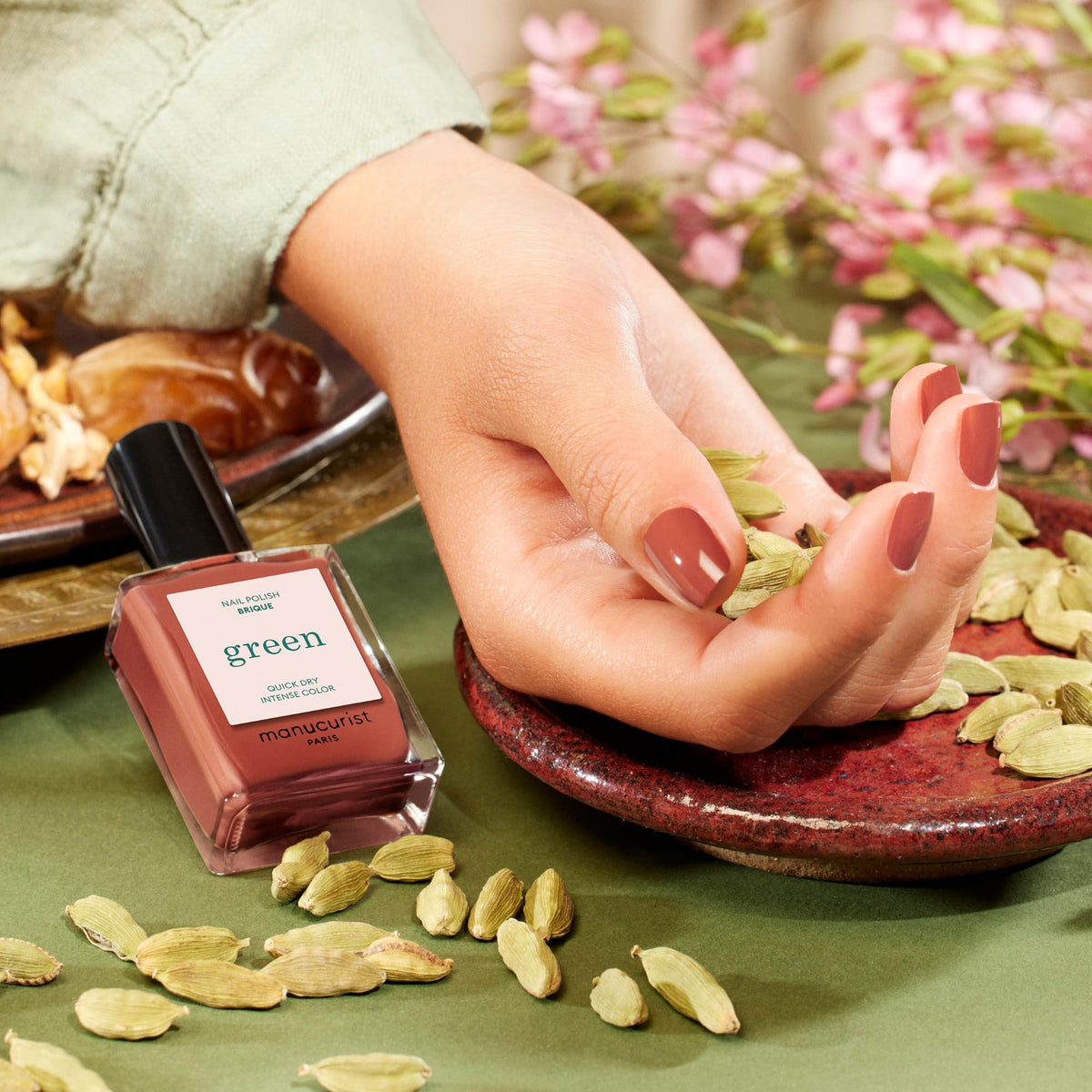 Manucurist Brique swatch on nails displaying opaque finish benefit: true-to-bottle color