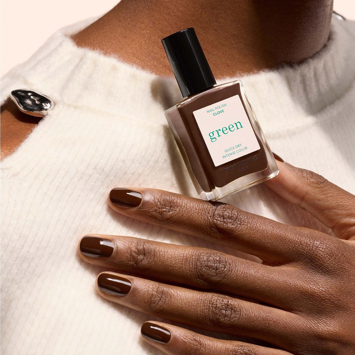 Manucurist swatch on skin showing true Clove color and opaque coverage