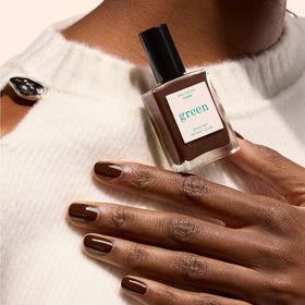 Manucurist swatch on skin showing true Clove color and opaque coverage